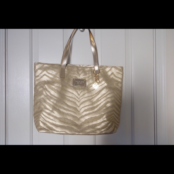 Michael Kors Handbags - Michael Kors Gold Travel Tote Bag🐅